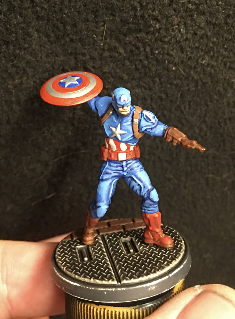 Still some work to do but I'm really happy at how he's coming along. Just threw inks over bright silver for the shield and did a silver star on his chest. More movie Cap than comic.