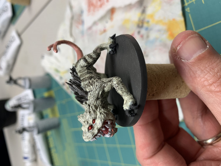 Tried a base layer for the fur, a dark wash and then dry brush to highlight back up. My first real go at trying those techniques. Added a few other highlights to the tail and spines.