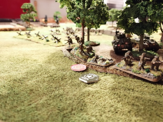 Red Platoon, supported by two Shermans, pinned down in the trees