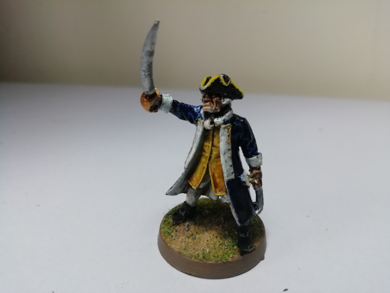 I painted the seamen to have blue jackets to tie them in with the captain