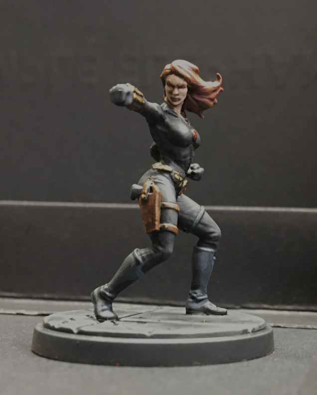 I don’t know why but I’m inordinately pleased with her. Perhaps it’s that I thought she would be the least interesting to paint (black is almost as tough and dull as white) or the little flash of red on her belt and zipper pull. Whatever the reason, I really like her. 