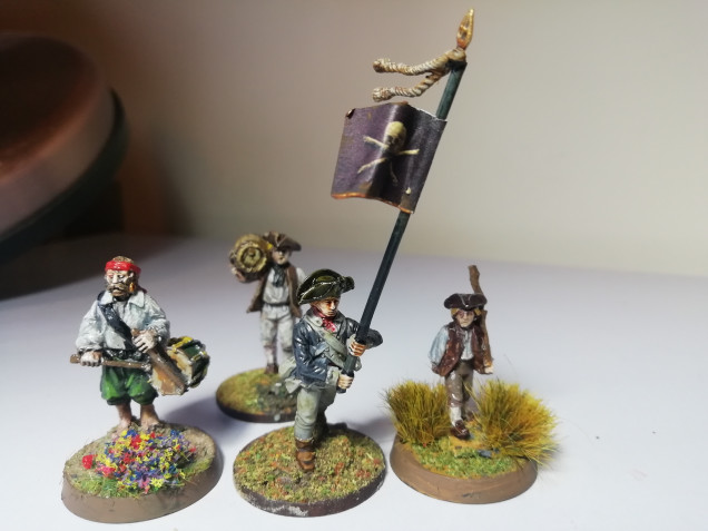 I had a spare standard bearer from my independence range so I stole a little pirate flag from the black seas game. Add a chap carrying rum and you have every pirates rally point