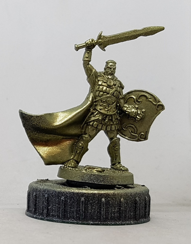 based with Darkstar Victorian Gold, then zenithally highlighted with 50/50 Victorian Gold / Darkstar Silver Verde.  he was then drybrushed with Silver Verde, washed with Handcraft Tabletop Algenmoos, and given a little Handcraft Tabletop Dunkelschatten in the deeper areas and select splashes