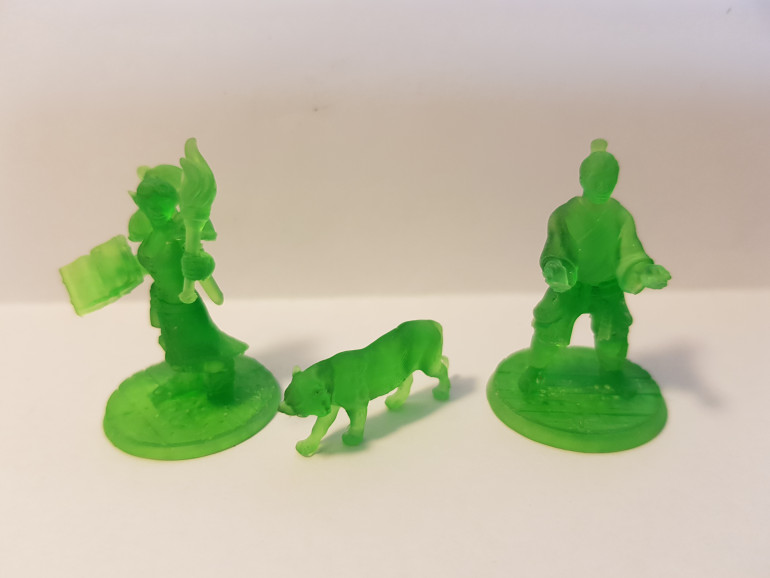 2 Hero Forge heroes and a tiger.