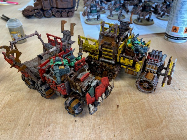 Bad Moons Trukk along side an Evil Sunz Trukk. If I had base coated the Bad Moons Trukk yellow, it would have looked very different and in my mind, not blended in with the rest of the army.