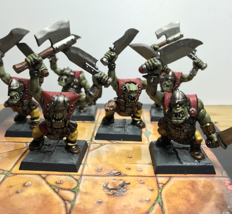 Orc boyz off looting in swish new clothes swinging there big choppas.