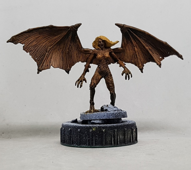 The lighter spots were given a light drybrush of P3 Trollblood Highlight, and the hands and feet were drybrushed P3 mouldy Ochre. Blonde Hair: Base with Reaper 09256 Blonde Shadow, drybrush with Reaper 09258 Blonde Highlight and wash with Coat d'arms 113 Flesh Ink Wash.