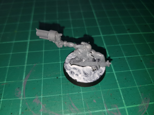 I slap a rough layer of PVA all over the base.  This doesn’t have to be too accurate, I’ve just tried to avoid the feet and lower areas of the mini.