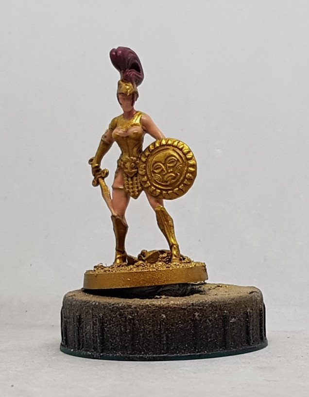 The gold was highlighted as with earlier models.  Female Skin: Base with P3 Midlund Flesh mixed with P3 Ryn Flesh.  Wash with Midlund Flesh and P3 Battledress Green.  Wash with Midlund Flesh and P3 Skorne Flesh.  Highlight with P3 Ryn Flesh.  Hair: Base P3 Sangine Base, Highlight P3 Sanguine Highlight