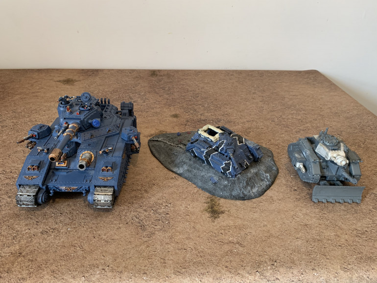 Baneblade and Leman Russ Demolisher rescued and will be added to the XXIV. The ruined Chimera from Forgeworld will make a nice piece of terrain once repaired, stripped of the old paint and painted to match everything else in the force