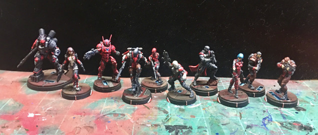 Still have some work to do on these but they’re starting to come together and…they’re on their proper bases! In future I will still stick them on temporary bases (like I did this time) but put them on their final, already painted, bases earlier—i.e. right after base coating. I will say that seeing an army come to life/come together is an exhilarating feeling. Not sure I’ll be able to switch over to Panoceania before I paint my Nomad TAGs. 