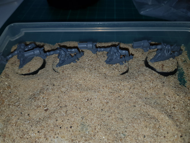 All the grots have a little play in the sandpit.  I leave them for a few moments for the sand to adhere.