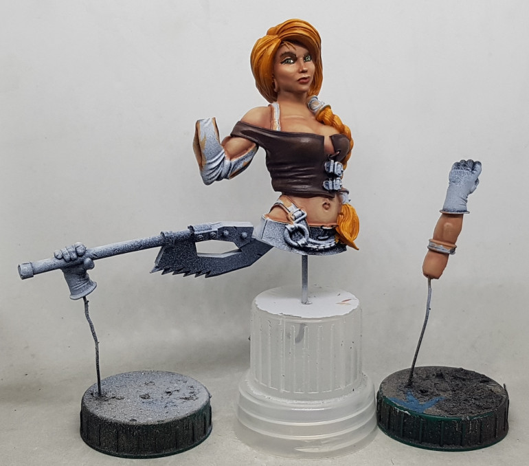 I thinned down 2:1 Orange Leather : VMC 70.918 Ivory and applied highlights on the sharper edges. I then put a few drops of water in a well and mixed in 1 brush of this and used this to highlight the surfaces carefully. That's the bodice done, I think.