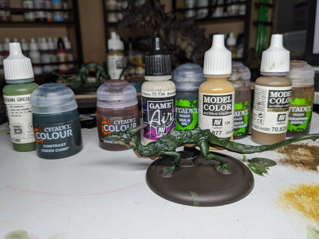 A picture of the paints used and an ickle babby dragon.  You can see on the left the basecolour and wash for the green.   Vallejo Russian Green and then Contrast Greed Camo as an inkwash, it gives a lovely rich dark green.  The only drawback is that it has a bit of a sheen