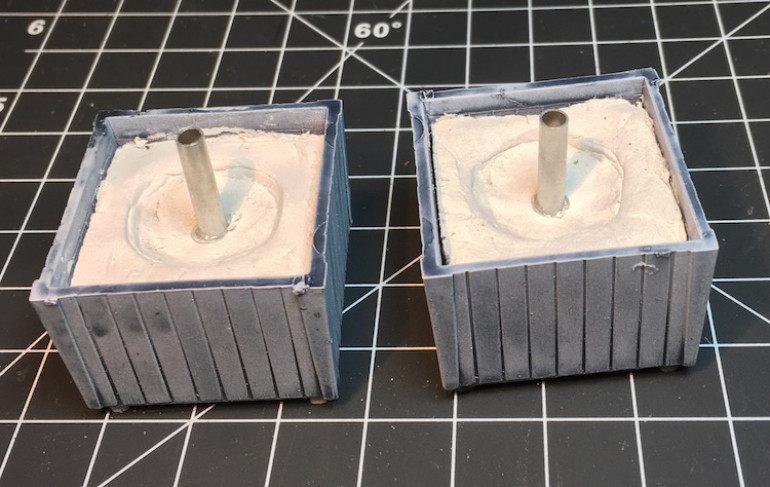 Toothpicks glued into the clay then aluminium cylinders from my scrap box are glued over them. 