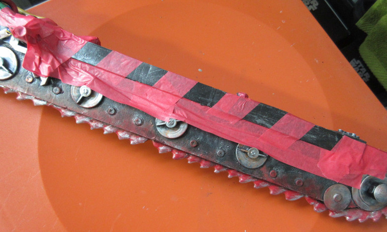 Make sure to rub the edges of the masking tape to seal it to the surface.