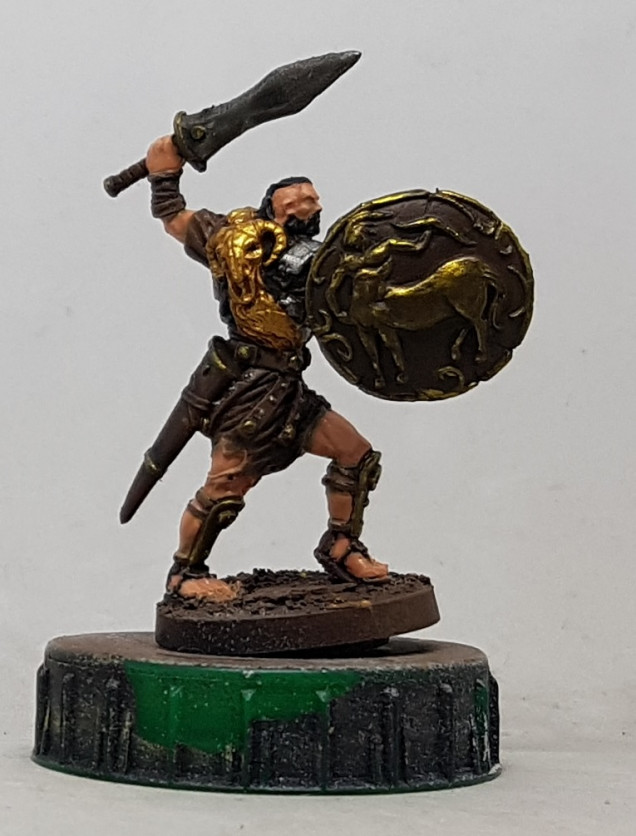 Iron: Base with P3 Pig Iron, wash with GW Nuln Oil and highlight with P3 Cold Steel.  Blighted Gold: Base with P3 Blighted Gold.  Wash with a mix of P3 Cryx Bane Base and P3 Brown Ink.  Wash with a mix of P3 Umbral Umber and P3 Coal Black.  Highlight with P3 Brass Balls. I took the Blighted Gold washes over the body of the shield too, to try and darken it and make it different to his body armour.  Fleece: Base with GW Retributor Gold, wash with GSW Pecaton Flesh and highlight with AK Old Brass and then AK Brass.  