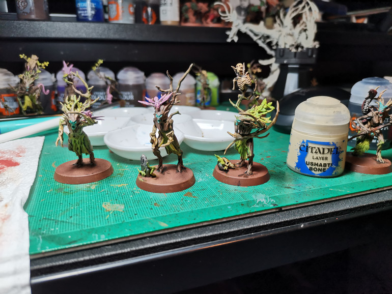 One problem I had when battling on the tabletop was that I kept forgetting about my dryad leader's extra attack dice and I  never could tell at a glance which blob of branches was in charge. So I wanted to differentiate the leaders. Easiest option; I took Skeleton Horde contrast paint  and painted their hands/branch tips and viola a dryad born to lead. Oh yeah, dry brush Ushabti Bone and your done!