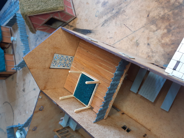 The reason for those stairs, I created a mezzanine floor for a bedroom. The bed is made from coffee stirred, match sticks with an off cut of brillo page for the mattress, once mostly covered in blankets and furs should be a good representation of the straw they used.