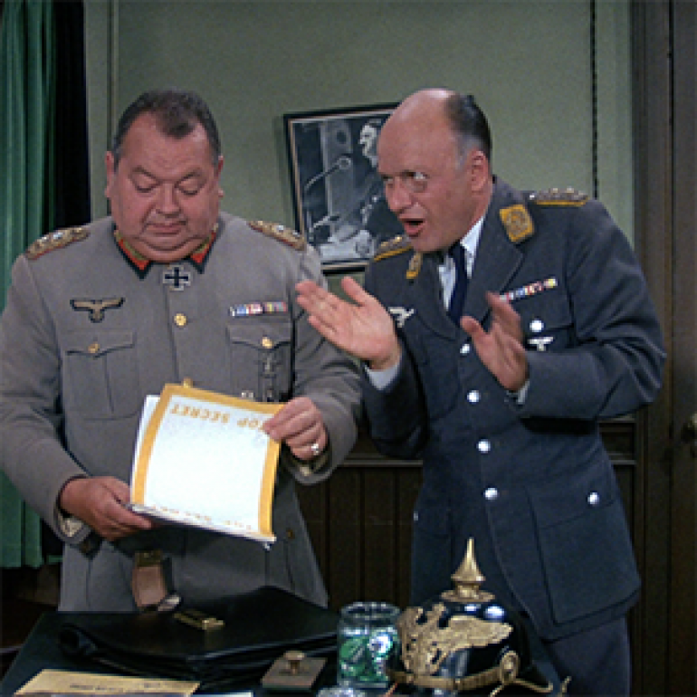 Very historical research, as you can see! Jokes aside, Hogan's Heroes actually seems to have gotten the uniforms of Klink and Schultz pretty well, even if there are some minor issues such as Norwegian/Danish rifles... (We could argue that they are Stomperud Krags, I guess.)