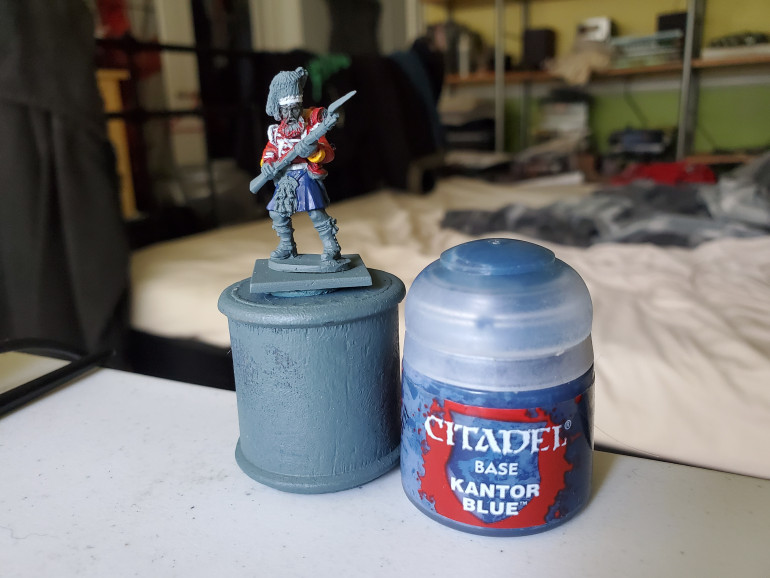 A nice solid basecoat of Kantor Blue is the starting point. Make sure it is nice and solid and be careful of any jacket tails or bits and bobs that you already painted. This is actually why I left the backpack and many of the accoutrements until after the kilt.