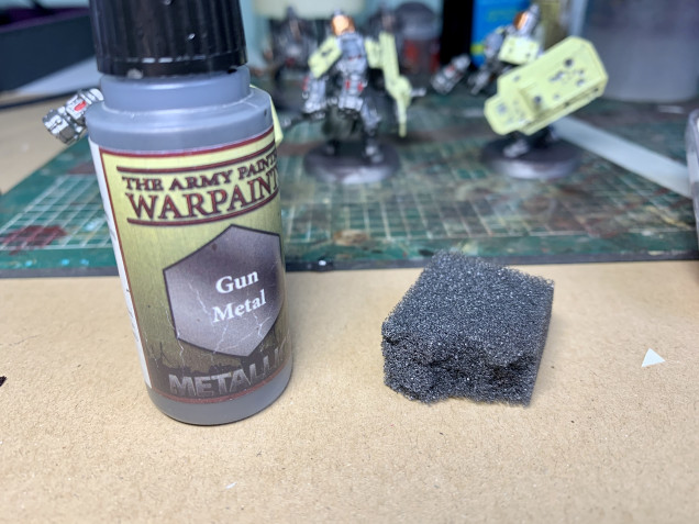 Now to add some weathering to the shields and shoulder plates. Simply use a bit of sponge and add a small amount of Gun Metal and lightly dab on the areas you want chipped. Then do the same again with a brown to get a simple yet effective effect