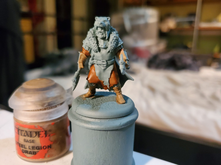 Steel Legion Drab was next. My pot of this is not doing so well, and somewhere in this process made a bit of a mess of one of the Champion's boots, but I tried to cover it up as tears in the material...it should have worked...