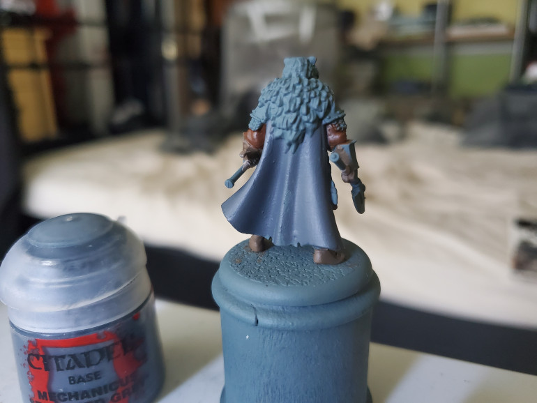 Then Mechanicus Standard Grey was used to tidy up the cloaks.