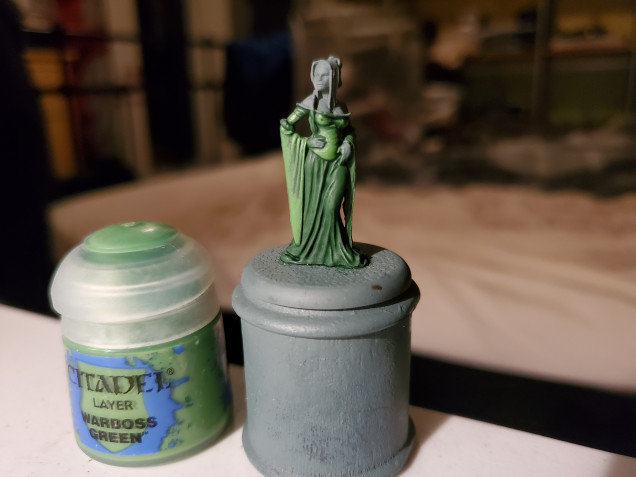 Next I started with the first deviation of tones. I layered Warboss Green over the bodice and sleeves, ignoring the darker recesses, brightening these areas up a touch.