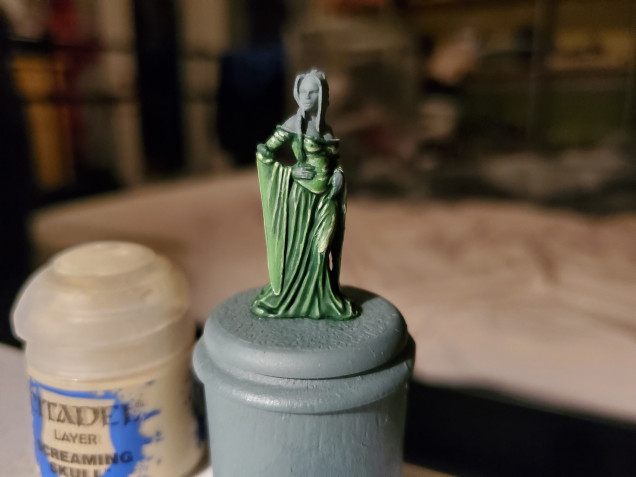 Then I did some extreme highlights on the lighter areas with Screaming Skull. Very small touches of this otherwise the colour can quickly turn beige. I also added a touch of this to the knee to help show off that area where she is slightly pulling up her gown along the knee... Floozie!