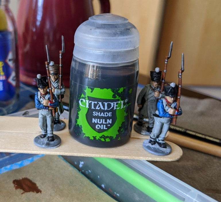 7. Nuln oil wash all over and then go back to highlight with base colours. 