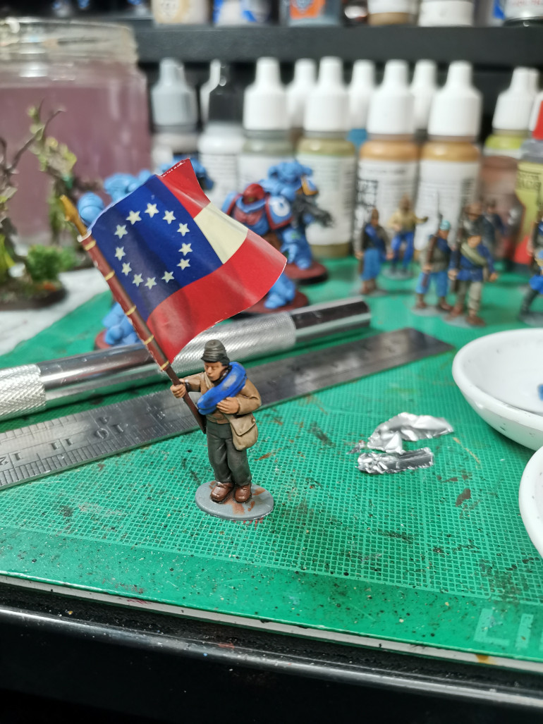 First attempt at a flag has turned out pretty good, I just need to go around the edge in red, white and blue to hide the white edge of the paper. Flag came with the set from Perry Minis