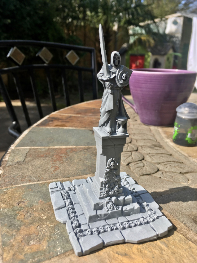 Primed model - in this case a statue from the Sigmarite Mausoleum set.