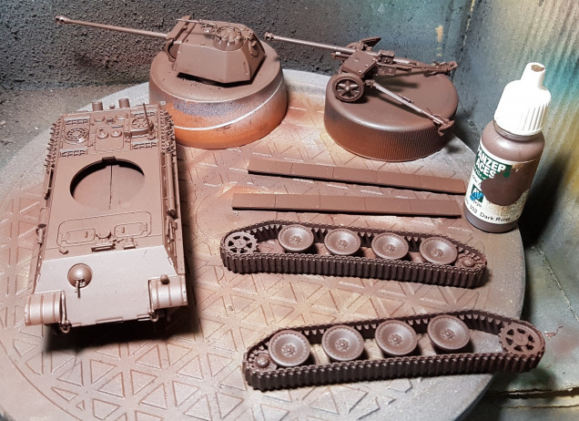 I don't have the paints used in the video so I am approximating from my collection.  First up, a base undercoat of VMC Dark Rust over primer.  This was then sealed with Matt Varnish.