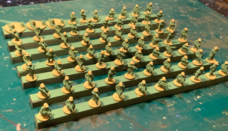 Sand colored helmets and bases.  Boots will be black, flesh hands and faces, two-tone AK weapons, and some more sand web gear to come.  An umber wash, followed by touch up and some basing material, and we'll be done.  With 70 figures ... and in 15mm ... the trick is to not paint each one like a 28mm Golden Button masterpiece.   