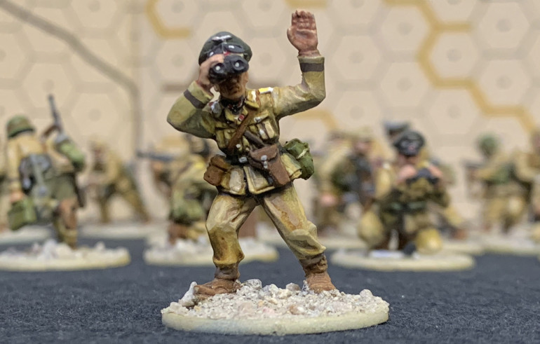 Probably my favorite guy, which I painted generally as a Oberst-Leutnant (Lt. Colonel) battalion commander.  It's a little hidden in shadow but I hope you can see my attempt at Knight's Cross ribbon around his neck and the badge ribbon on his tunic.  This guy's seen some sh*t!  :D All these figures have brown cuffbands to approximate various DAK units, not really aiming at one in particular.