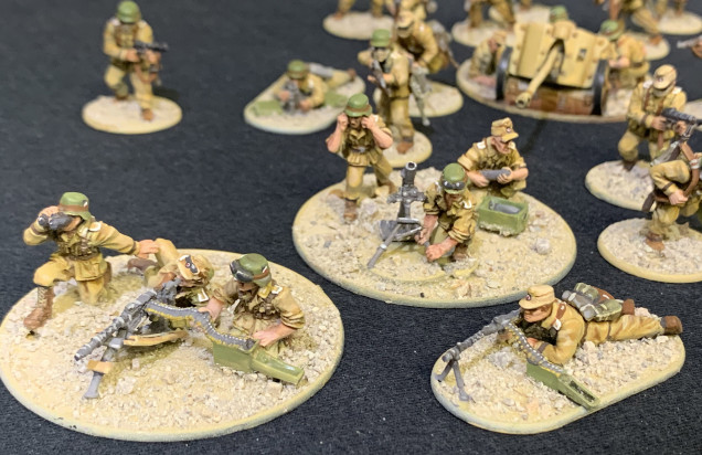 MG-34 support teams (MMG and LMG support roles) and the mortar crew. German shields on the helmets and roundels on the campaign caps hand-painted.