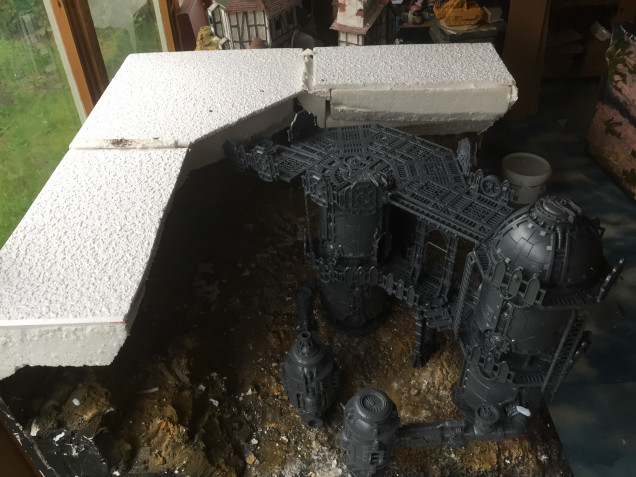 WIP to date - having decided to reconfigure the set up of the Ferantonic furnaces, I now have the basis of display board to start with plastering the rock faces and painting the structures.