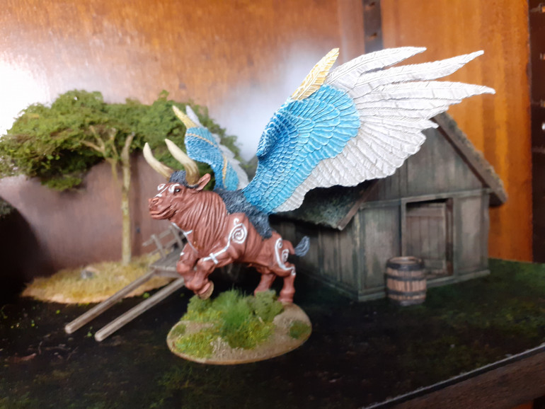 Had this model for ages, converted from the old Chaos Dwarf Taurus, with a mouth resculpt and old metal Tzeentch Lord of Change wings. I was originally planning to paint him white, but then I found an image on line.