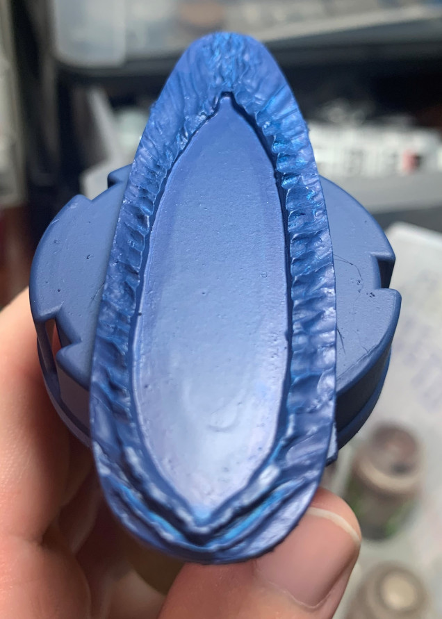 Using an airbrush I applied Citadel's Kantor Blue accross the whole base. Then I tidied it up with a little bit of painting in the recesses and at the edges.