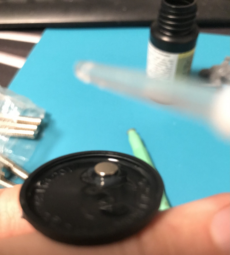 Put the magnet on, and add a droplet of super glue activator