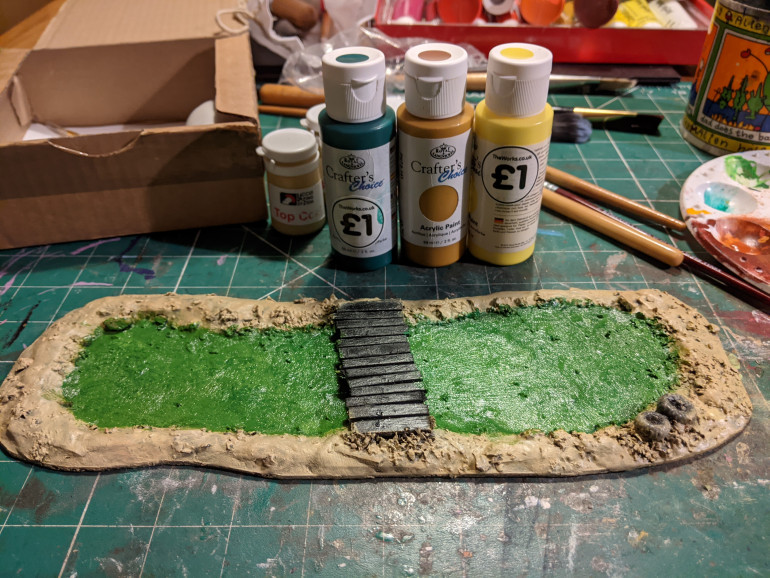 I remembered to glue one of the alien fungus plants onto the side then psinted.  I used strong green colours for the water but this will be knocked back a lot by the swamp effect water I'm going to add.