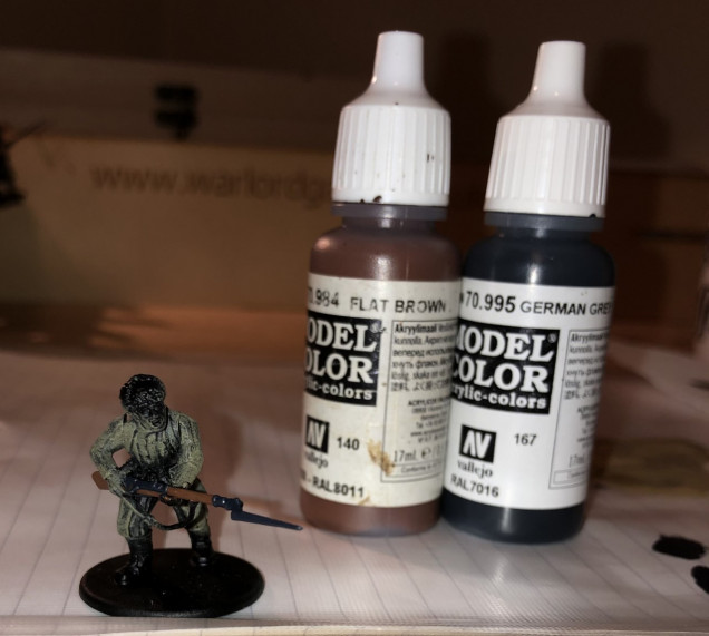 Step 4: Now its time to paint the weapons. I use Flat Brown for wooden stocks (I also pick out bayonet handles located on some of the figures belts and any helmet straps with this colour) and German Grey for metal, which I think gives the metal a nice blue-ish tinge. 