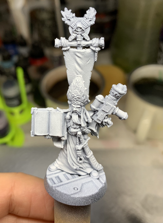 Primed black with a white ink heavy zenith, and extra white on the robes