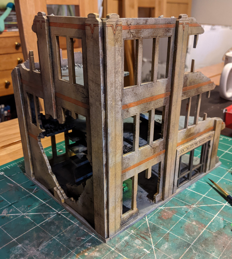 Finally I picked out the orange stripe with a thin coat to leave the grime showing through and dry brushed a little white along the top edges of the walls and window frames.