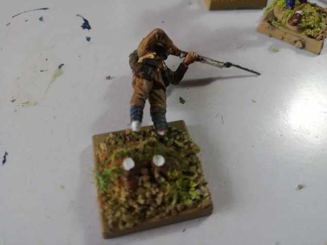 Rebasing my old minis to match my afghans. Had a few casualties along the way. He went feet first.