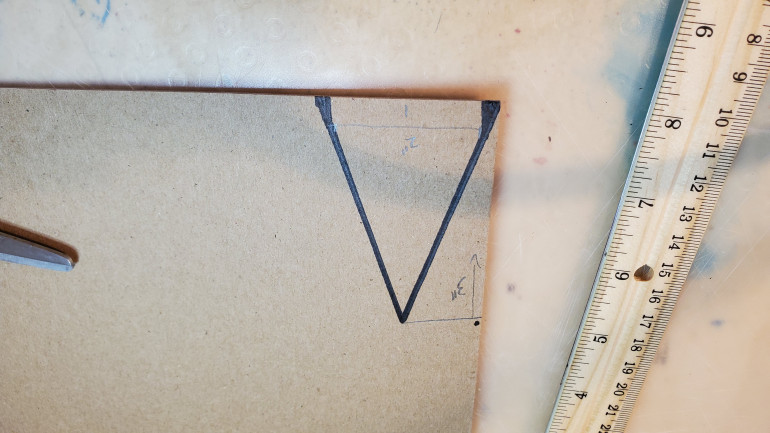 I then traced a simple profile onto some chipboard. These pieces will serve as the aerodynamic heat shields of the unit so I went with a simple triangular shape to accentuate the height of the unit.