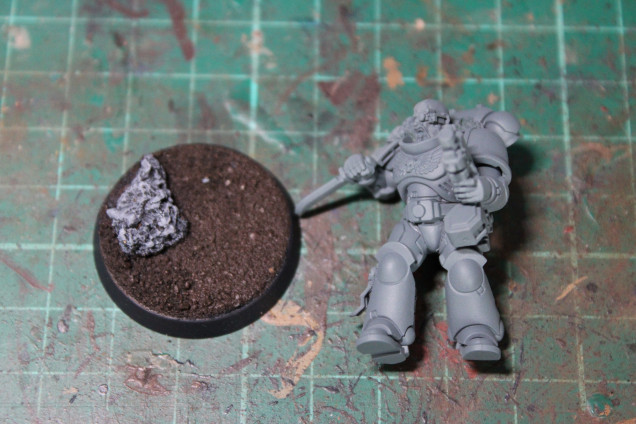 Based Mech standard Grey, the base is Rhinox hide/Mordnefang and the rocks are drybrushed with Dawnstone and Celestra Grey