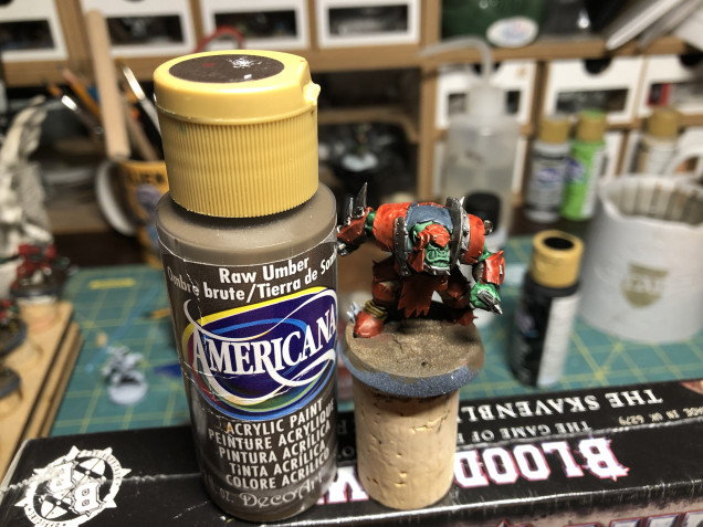 I use brown craft paint to paint the altered base as it is cheaper that hobby paint and has a decent coverage.