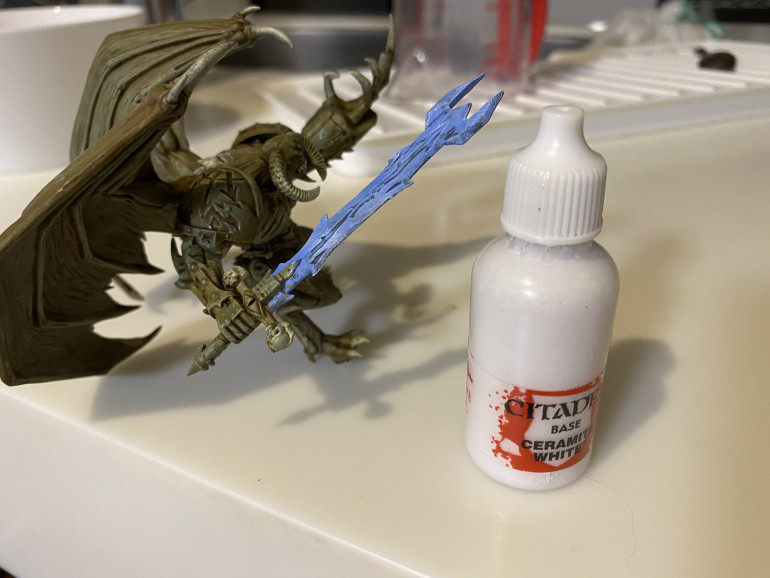 Dry brush white to create an easy power sword effect.